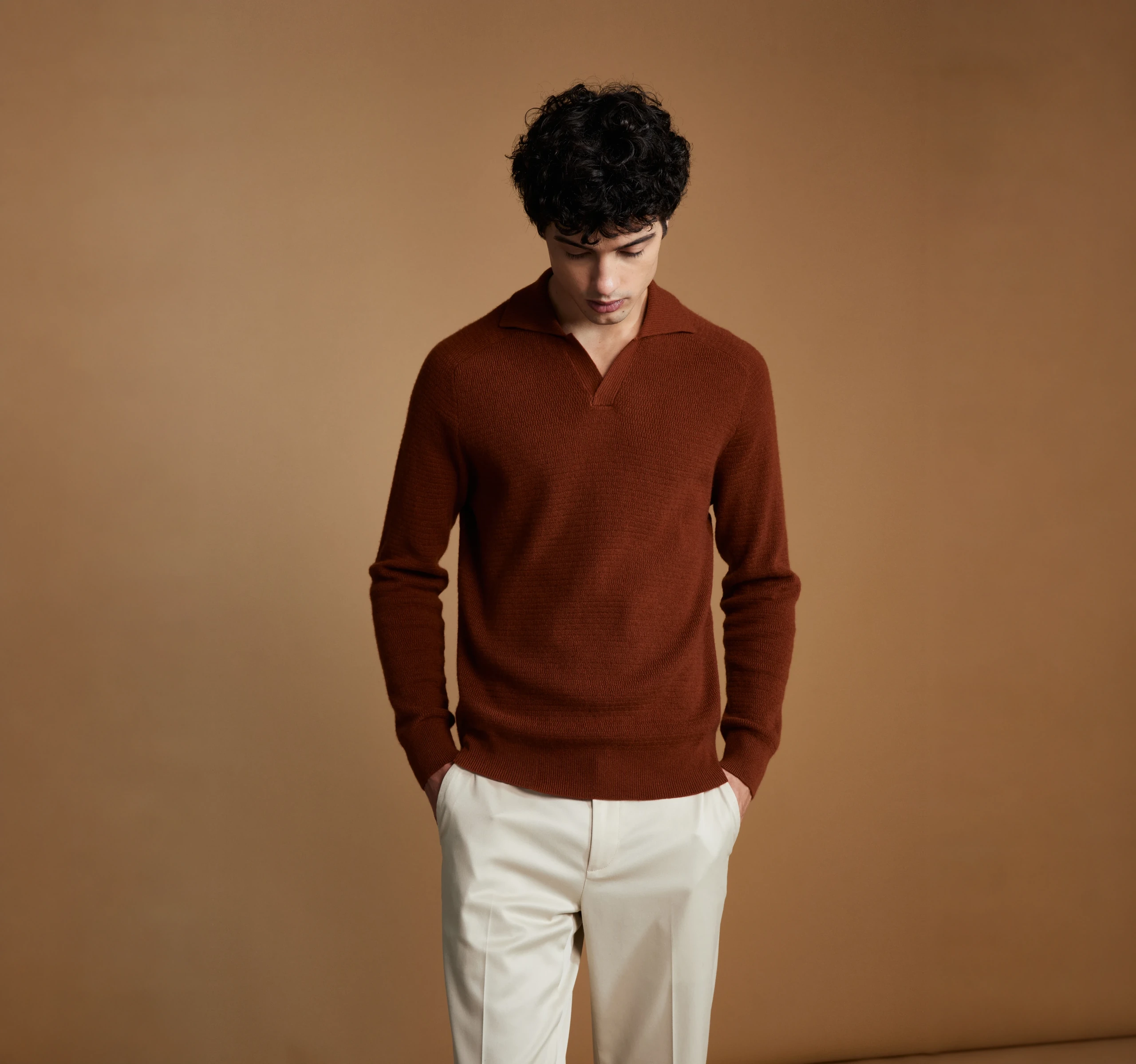 A knitwear fitting focused on sleeve length and finishing