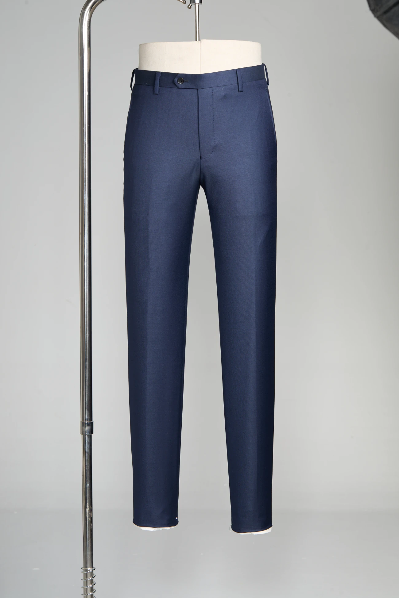 Charcoal pleated dress trousers with polished leather shoes