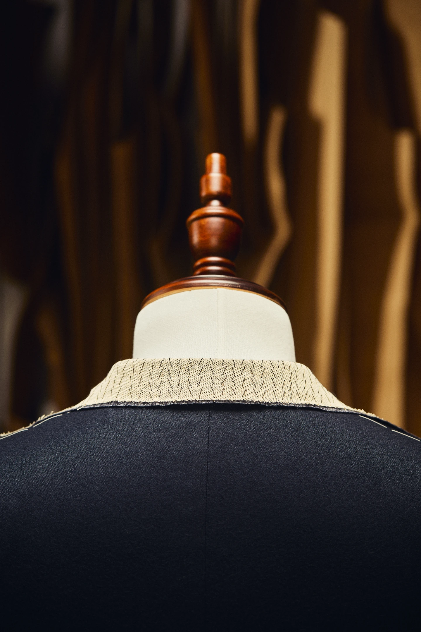 Suiting cloth, lapel samples, linings, buttons, thread, and tailoring shears