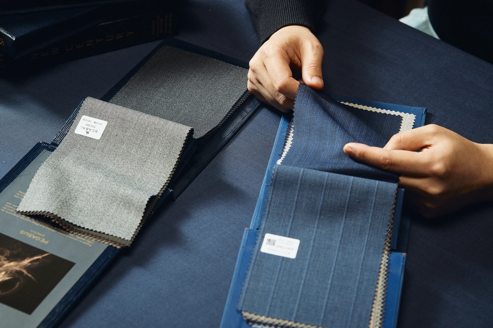 A tailor drafting an individual jacket pattern from scratch