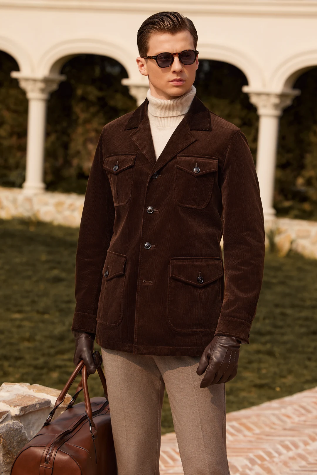 Man wearing a casual sport coat and knitwear on a city street
