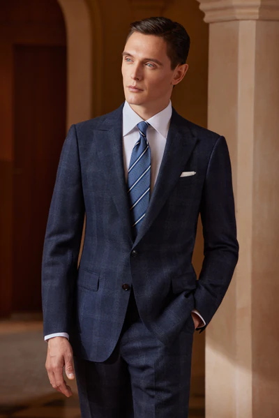 Folded white and pale blue tailored dress shirts