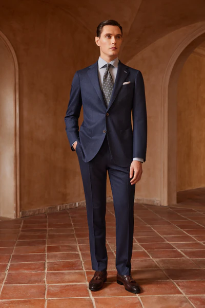 Navy made-to-measure suit with a white shirt and dark tie